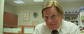 Movie still from “It” (2017), directed by Andy Muschietti – A person wearing a shirt and tie; Close Up shot, Low angle