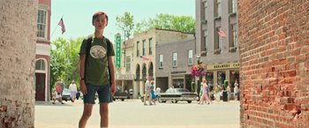 Movie still from “It” (2017), directed by Andy Muschietti – A young boy is walking down the street; Wide shot, Low angle