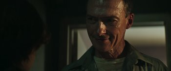 Movie still from “It” (2017), directed by Andy Muschietti – A person smiling for the camera; Close Up shot, Over the shoulder angle