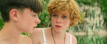 Movie still from “It” (2017), directed by Andy Muschietti – Two young people are talking to each other outside; Close Up shot, Over the shoulder angle