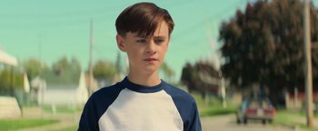 Movie still from “It” (2017), directed by Andy Muschietti – A young boy is looking at the camera; Close Up shot, Low angle