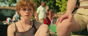 Movie still from “It” (2017), directed by Andy Muschietti – A woman sitting on top of a bench next to a man; Close Up shot, Over the shoulder angle