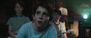 Movie still from “It” (2017), directed by Andy Muschietti – A young boy is looking up at the sky; Close Up shot, Low angle