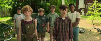 Movie still from “It” (2017), directed by Andy Muschietti – A group of young people standing next to each other; Medium shot, Low angle