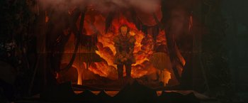 Movie still from “It” (2017), directed by Andy Muschietti – A scene of a scene with a clown in the middle of the scene; Wide shot, Low angle