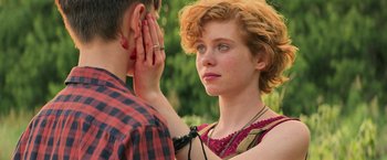 Movie still from “It” (2017), directed by Andy Muschietti – A young man and a young woman looking into each others eyes; Close Up shot, Over the shoulder angle