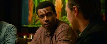 Movie still from “It Chapter Two” (2019), directed by Andy Muschietti – A man in a brown shirt talking to another man; Close Up shot, Over the shoulder angle