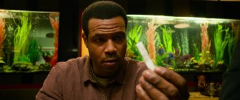 Movie still from “It Chapter Two” (2019), directed by Andy Muschietti – A person holding something in his hand; Close Up shot, Over the shoulder angle