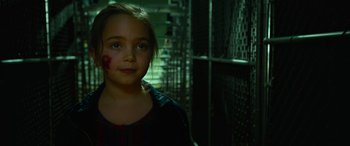 Movie still from “It Chapter Two” (2019), directed by Andy Muschietti – A young girl with blood all over her face; Close Up shot, High angle