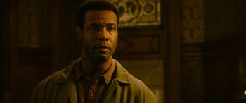 Movie still from “It Chapter Two” (2019), directed by Andy Muschietti – A man standing in front of a wall; Close Up shot, Low angle