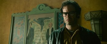 Movie still from “It Chapter Two” (2019), directed by Andy Muschietti – A man standing in front of a picture of a woman; Close Up shot, Low angle