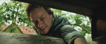 Movie still from “It Chapter Two” (2019), directed by Andy Muschietti – A person leaning on a wall; Close Up shot, Low angle