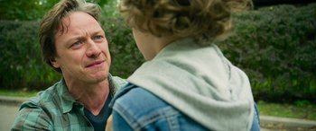 Movie still from “It Chapter Two” (2019), directed by Andy Muschietti – A man talking to a boy in a denim jacket; Close Up shot, Over the shoulder angle