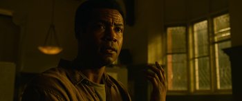 Movie still from “It Chapter Two” (2019), directed by Andy Muschietti – A person with his hand up to his face; Close Up shot, Low angle