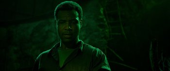 Movie still from “It Chapter Two” (2019), directed by Andy Muschietti – A man standing in the dark in a dark room; Close Up shot, Low angle