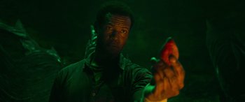 Movie still from “It Chapter Two” (2019), directed by Andy Muschietti – A man holding a cell phone in a dark room; Close Up shot, Overhead angle