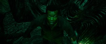 Movie still from “It Chapter Two” (2019), directed by Andy Muschietti – A man with green paint on his face; Medium shot, Overhead angle