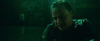 Movie still from “It Chapter Two” (2019), directed by Andy Muschietti – A man in a dark room with water on his face; Close Up shot, Low angle