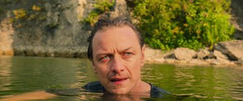 Movie still from “It Chapter Two” (2019), directed by Andy Muschietti – A person in a body of water; Close Up shot, Over the shoulder angle