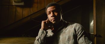 Movie still from “It Chapter Two” (2019), directed by Andy Muschietti – A man is talking on a cell phone; Close Up shot, Low angle