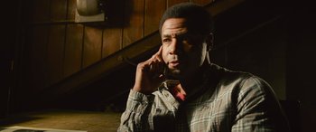 Movie still from “It Chapter Two” (2019), directed by Andy Muschietti – A man is talking on a cell phone; Close Up shot, Low angle