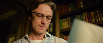 Movie still from “It Chapter Two” (2019), directed by Andy Muschietti – A person wearing glasses in a room; Close Up shot, Low angle