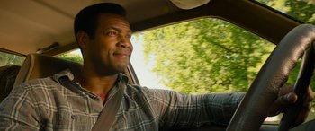 Movie still from “It Chapter Two” (2019), directed by Andy Muschietti – A man sitting in the driver's seat of a car; Close Up shot, Over the shoulder angle