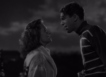 Movie still from “It's a Wonderful Life” (1946), directed by Frank Capra – A man and a woman standing next to each other in front of a cloudy sky; Medium shot, Low angle