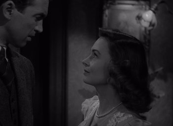 Movie still from “It's a Wonderful Life” (1946), directed by Frank Capra – A man and a woman looking at one another; Close Up shot, Low angle