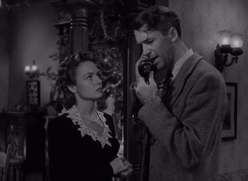 Movie still from “It's a Wonderful Life” (1946), directed by Frank Capra – A man and a woman standing next to each other; Medium shot, Low angle