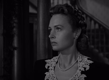 Movie still from “It's a Wonderful Life” (1946), directed by Frank Capra – A black and white photo of a woman with a necklace; Close Up shot, Low angle