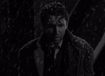Movie still from “It's a Wonderful Life” (1946), directed by Frank Capra – A black and white photo of a man in the snow; Close Up shot, Low angle