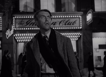 Movie still from “It's a Wonderful Life” (1946), directed by Frank Capra – A black and white photo of a man looking up; Medium shot, Low angle