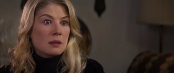 Movie still from “Jack Reacher” (2012), directed by Christopher McQuarrie – A person with long blonde hair; Close Up shot, Over the shoulder angle