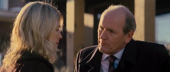 Movie still from “Jack Reacher” (2012), directed by Christopher McQuarrie – An older man and a young woman talking to each other; Close Up shot, Over the shoulder angle