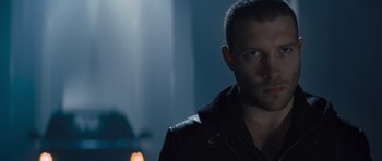 Movie still from “Jack Reacher” (2012), directed by Christopher McQuarrie – A person wearing a black jacket; Close Up shot, Low angle