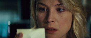 Movie still from “Jack Reacher” (2012), directed by Christopher McQuarrie – A person with blue eyes looking at the camera; Close Up shot, Over the shoulder angle