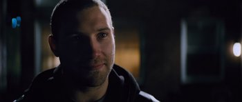 Movie still from “Jack Reacher” (2012), directed by Christopher McQuarrie – A person's face in the dark; Close Up shot, Over the shoulder angle