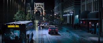 Movie still from “Jack Reacher” (2012), directed by Christopher McQuarrie – Cars are parked on the side of the street; Extreme Wide shot, High angle