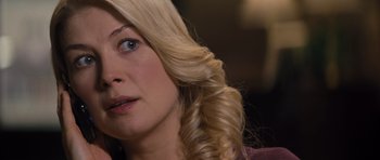 Movie still from “Jack Reacher” (2012), directed by Christopher McQuarrie – A person with long blonde hair; Close Up shot, Over the shoulder angle