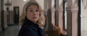 Movie still from “Jack Reacher” (2012), directed by Christopher McQuarrie – A person with blonde hair; Close Up shot, Over the shoulder angle