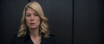 Movie still from “Jack Reacher” (2012), directed by Christopher McQuarrie – A woman with blonde hair wearing a black shirt; Close Up shot, Over the shoulder angle