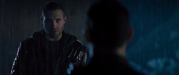 Movie still from “Jack Reacher” (2012), directed by Christopher McQuarrie – A man in a leather jacket looking into a mirror; Close Up shot, Over the shoulder angle