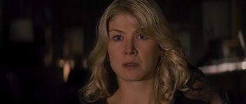 Movie still from “Jack Reacher” (2012), directed by Christopher McQuarrie – A person with long blonde hair; Close Up shot, Over the shoulder angle