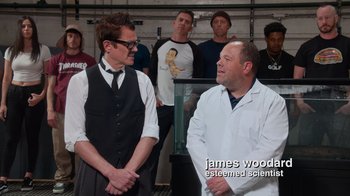 Movie still from “Jackass 4.5” (2022), directed by Jeff Tremaine – A group of men standing next to each other in a room; Medium shot, Over the shoulder angle