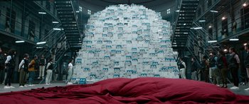 Movie still from “Jawan” (2023), directed by Atlee – A large amount of boxes stacked on top of each other; Extreme Wide shot, Overhead angle