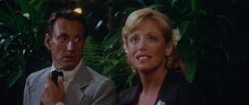 Movie still from “Jaws 2” (1978), directed by Jeannot Szwarc – A woman with blonde hair standing next to a man; Close Up shot, Over the shoulder angle