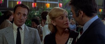 Movie still from “Jaws 2” (1978), directed by Jeannot Szwarc – A person with a flower in her hair; Close Up shot, Over the shoulder angle