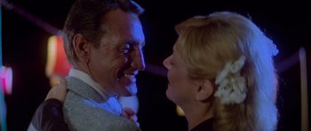 Movie still from “Jaws 2” (1978), directed by Jeannot Szwarc – A man and a woman smiling at each other; Close Up shot, Low angle