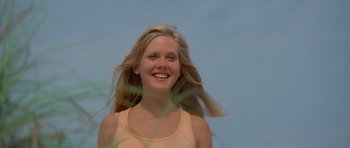 Movie still from “Jaws 2” (1978), directed by Jeannot Szwarc – A beautiful young blond woman smiling for the camera; Close Up shot, Low angle
